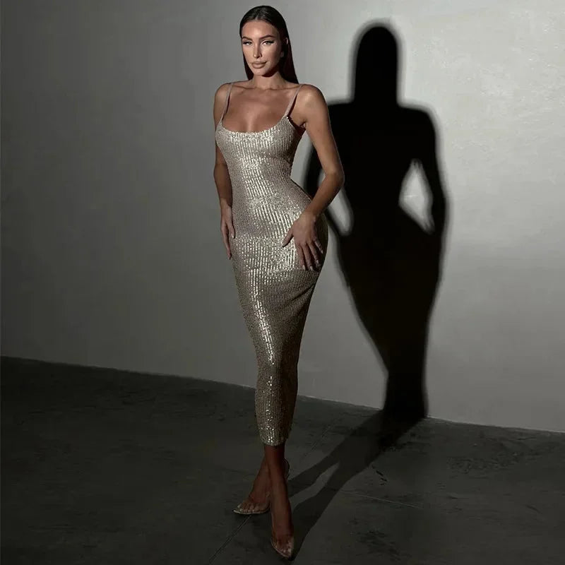 "Black sequined spaghetti-strap dress with a delicate and elegant design, perfect for special occasions."