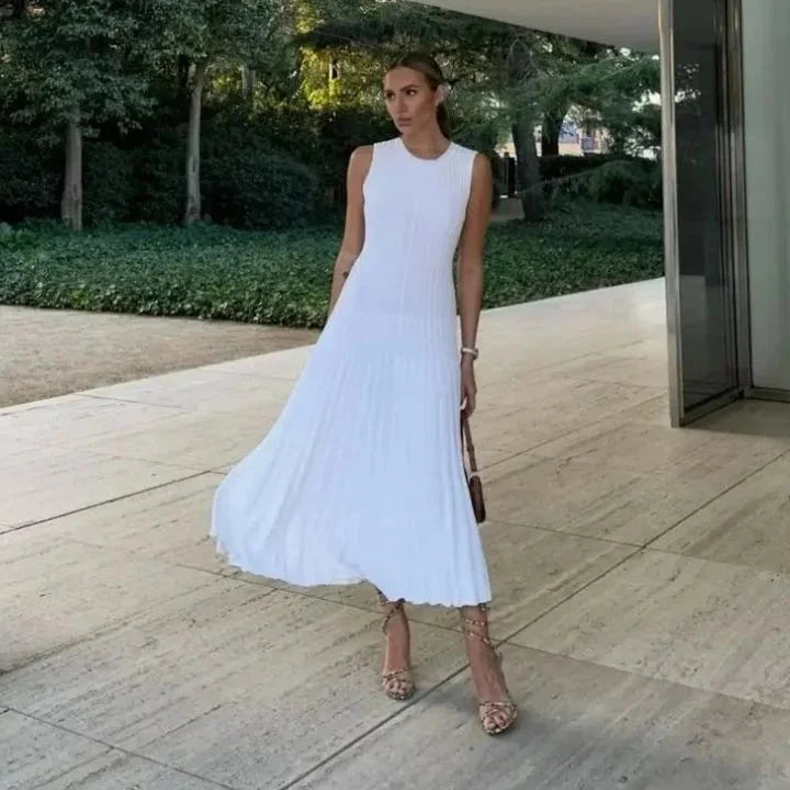Sleeveless pleated maxi dress in soft, flowing fabric for versatile wear-anywhere style.