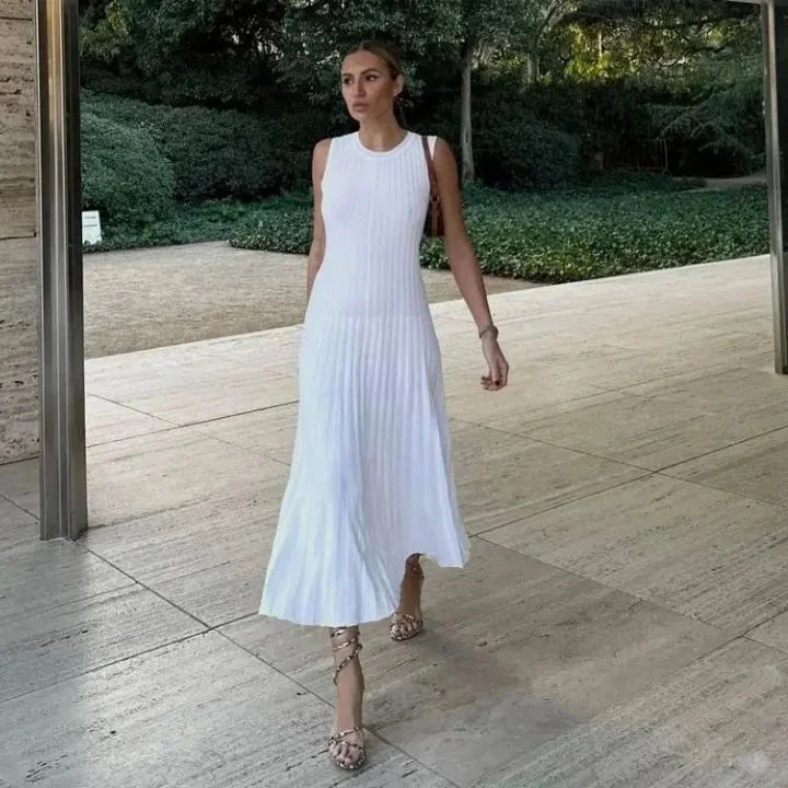Light Beige sleeveless maxi dress with pleats for versatile wear. Made from flowing fabric for comfort and style.