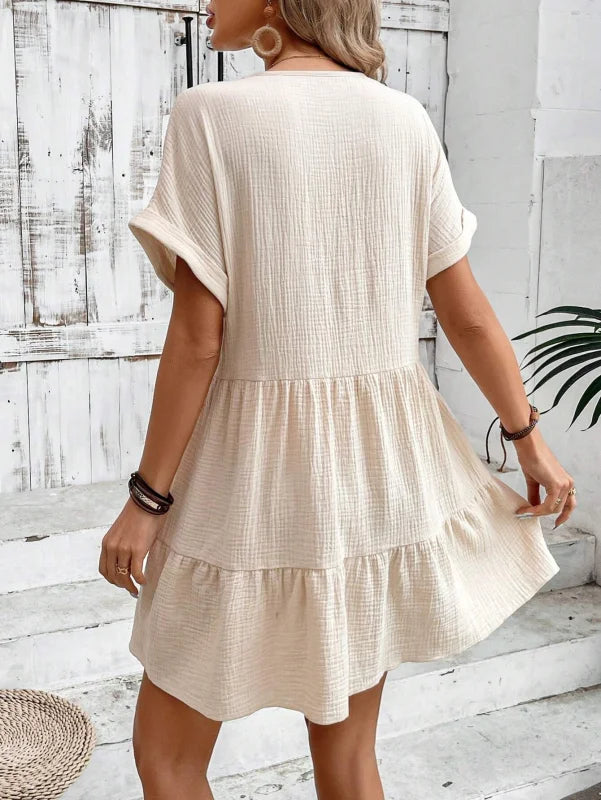 Flowy V-neck mini dress with pleated skirt made from soft chiffon material in a elegant and chic design.