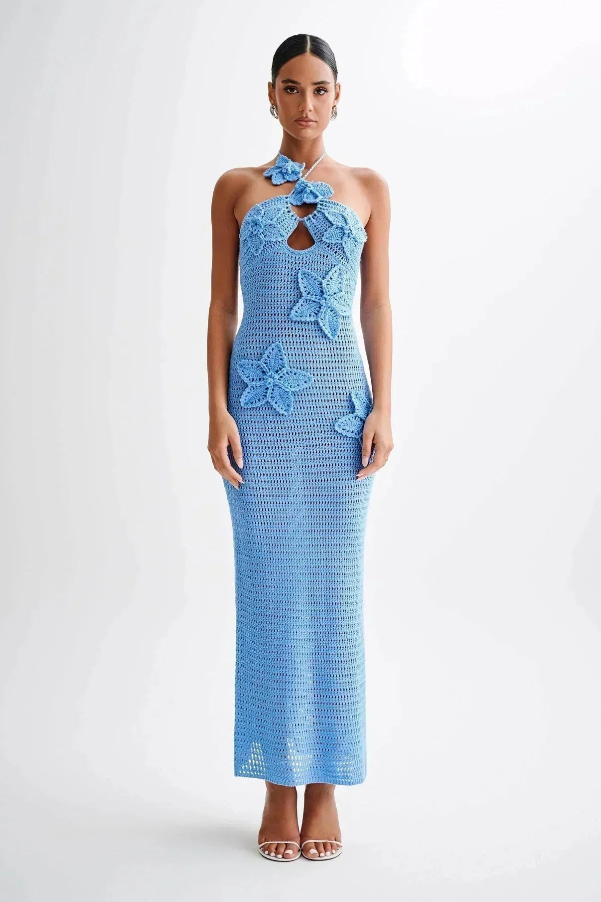 Blue crochet maxi dress with delicate floral accents, perfect for a boho summer style.