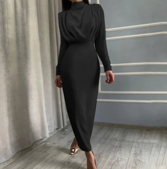 Black midi dress with a draped back, perfect for a formal event. Made from soft flowing fabric.