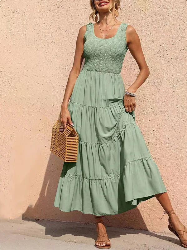 Ainslee sleeveless tiered maxi dress in a soft, flowy fabric with a tiered design and a stylish, timeless silhouette.