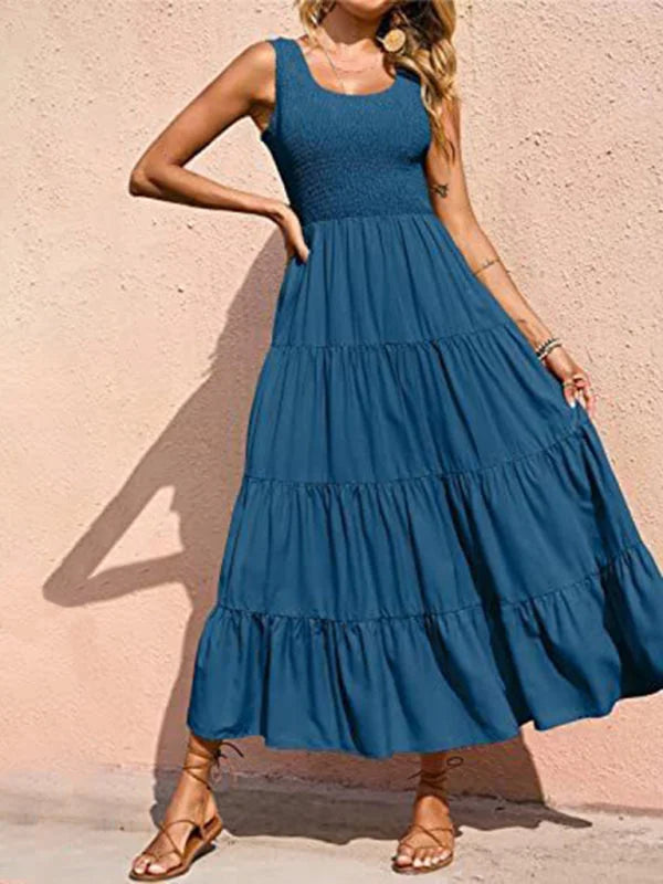 Peacock blue tiered maxi dress with sleeveless design, made in a flowy material, perfect for effortless summer style.