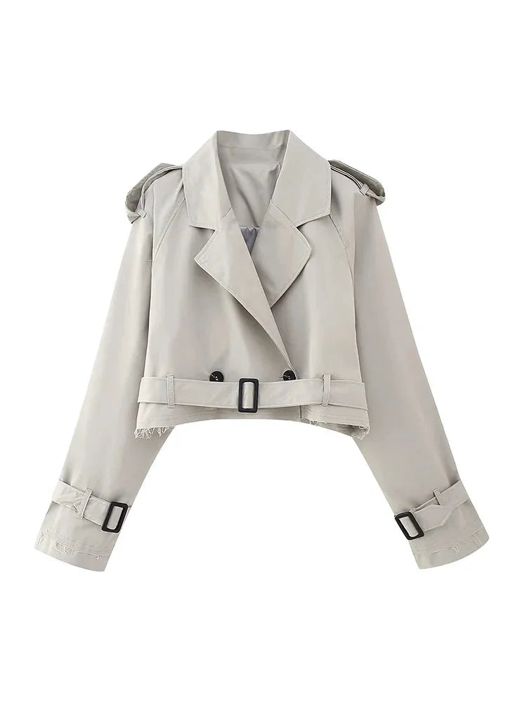 Gray cropped style jacket in a soft cotton blend with buckle accents. Timeless design for versatile styling.