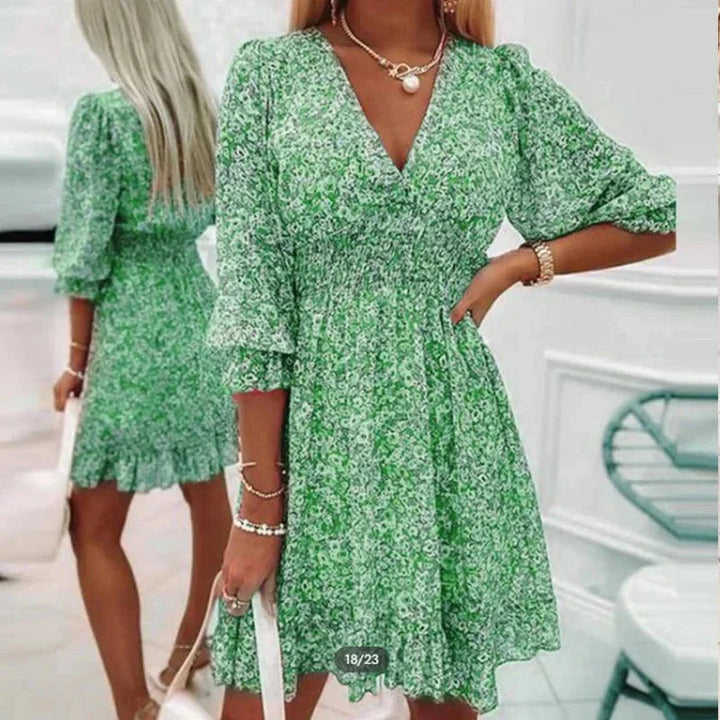 "Green floral short dress with V-neck for women, made of breathable fabric, perfect for summer outings or casual occasions."