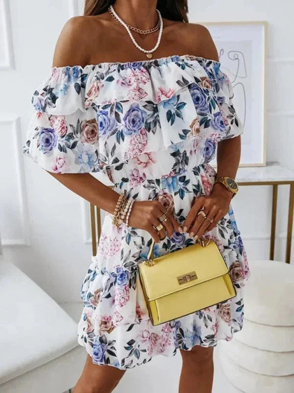 "Alaiyah women's dress featuring floral print, tiered skirt detail, and soft cotton fabric in light blue color."