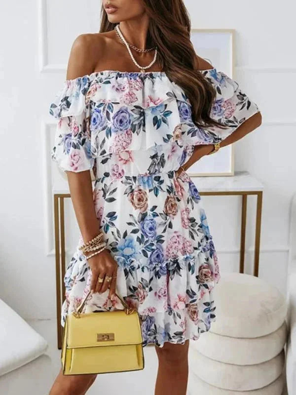 "Alaiyah Women's floral dress with tiered skirt in lightweight cotton fabric, featuring a vibrant floral print and flowing…