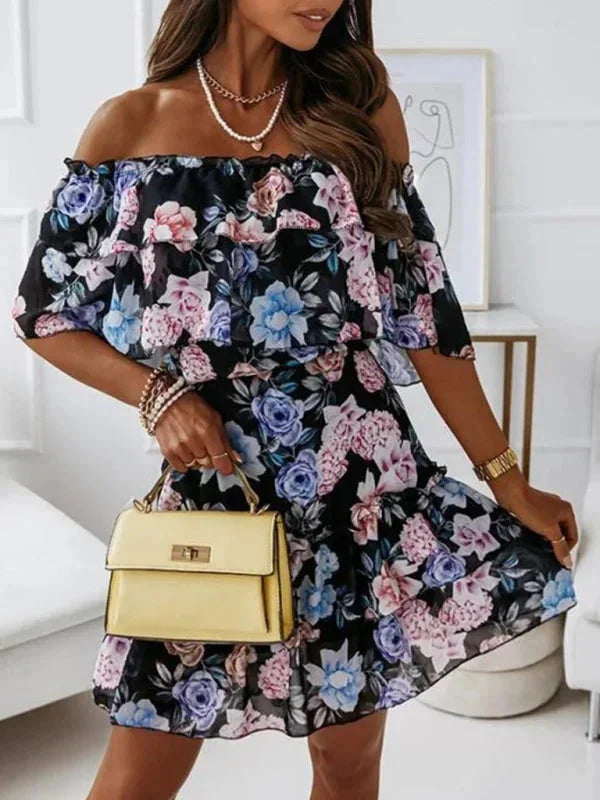 Women's floral dress with tiered skirt in soft cotton blend fabric, featuring a vibrant floral pattern and breezy tiered…