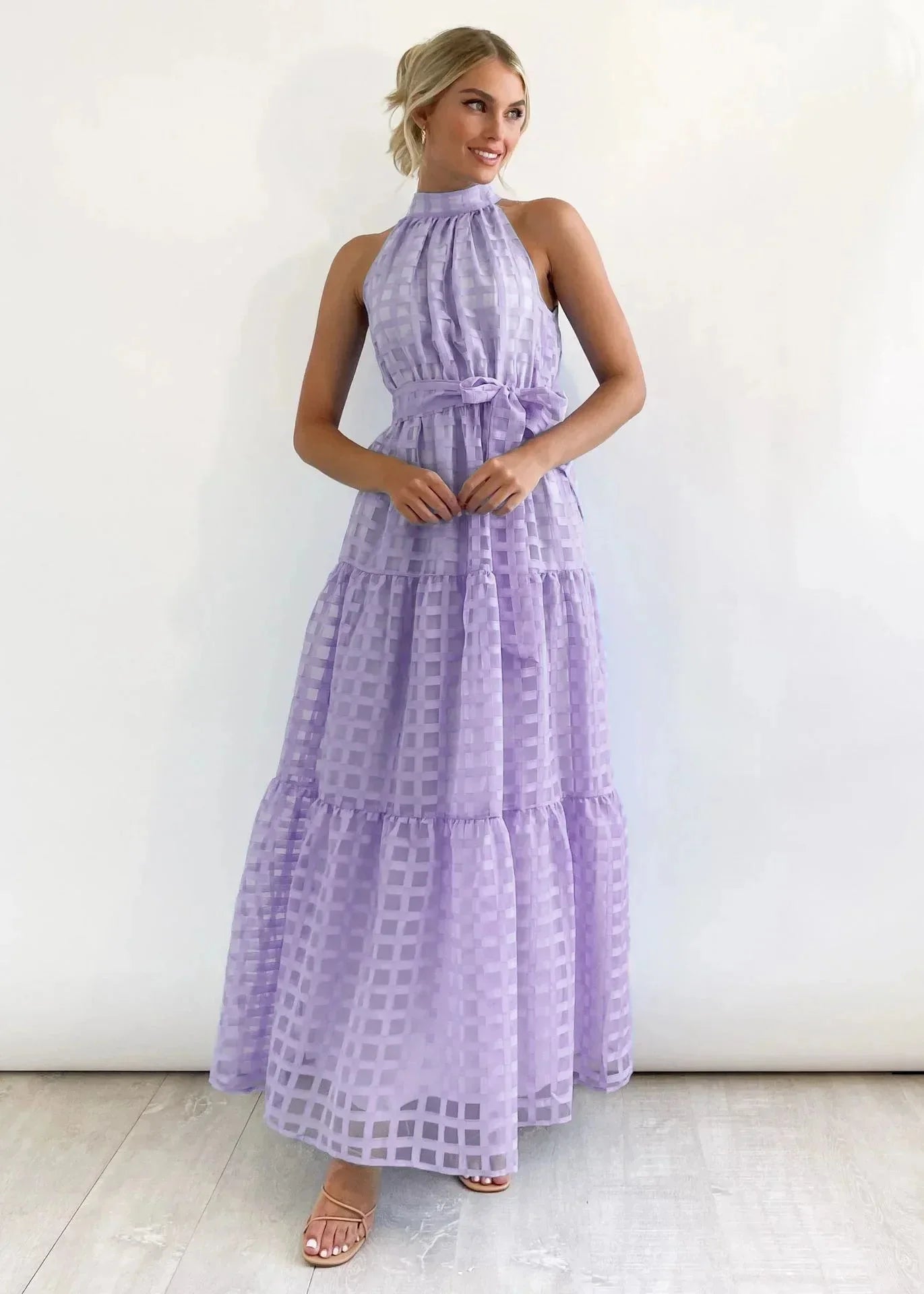 Purple tiered halter neck summer dress made of lightweight cotton blend with a flowing design perfect for warm weather…