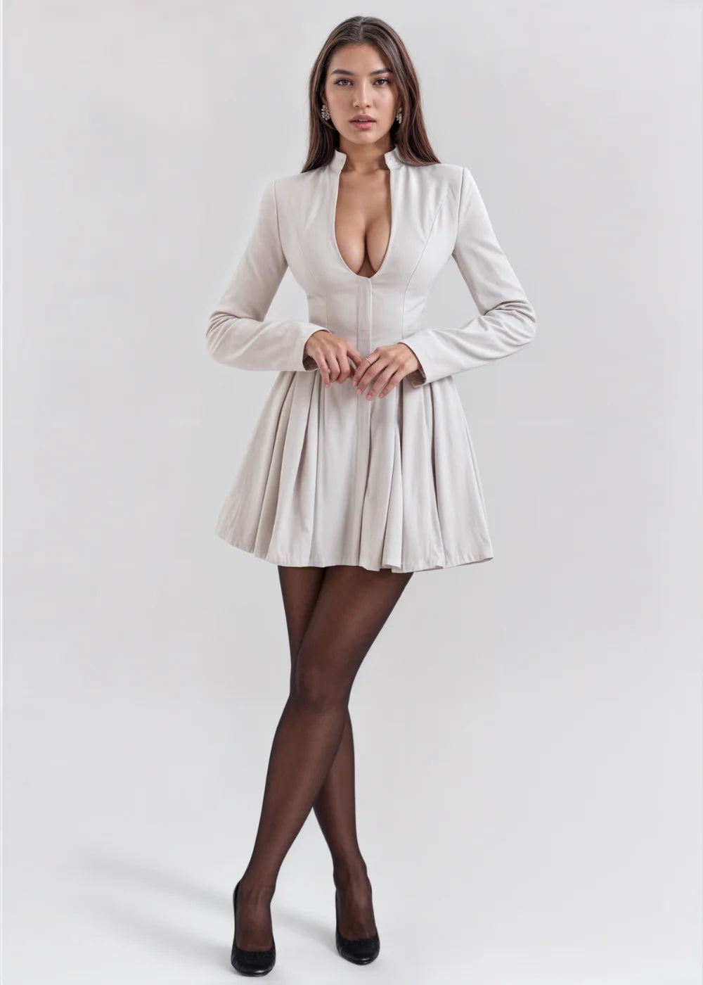 Cream flared mini dress featuring a deep V-neckline, perfect for a chic and elegant look.