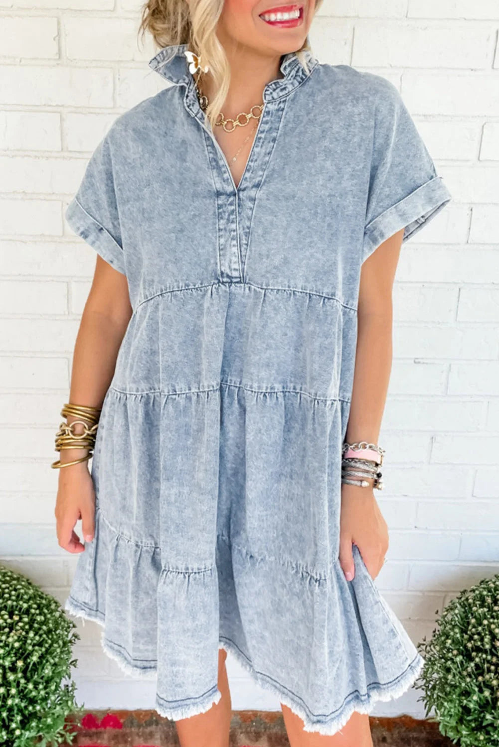 Short-sleeve acid-wash denim dress featuring a relaxed fit and frayed hem, perfect for casual outings in a comfortable…