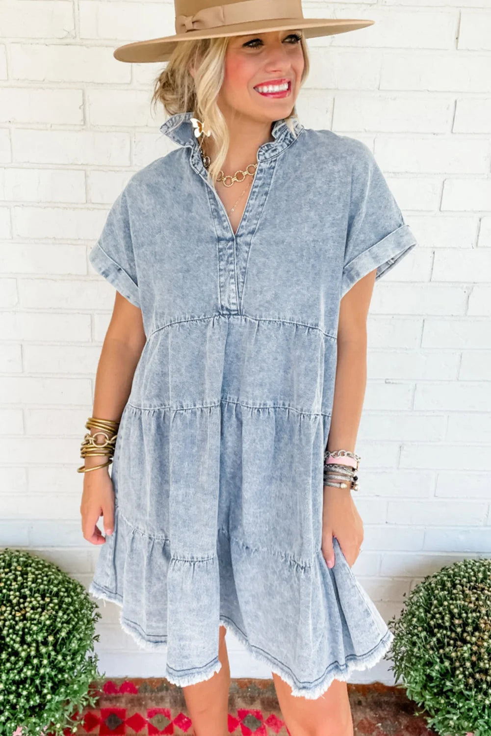 Short-sleeve acid-wash denim dress in a relaxed fit with a button-up front and belted waist.