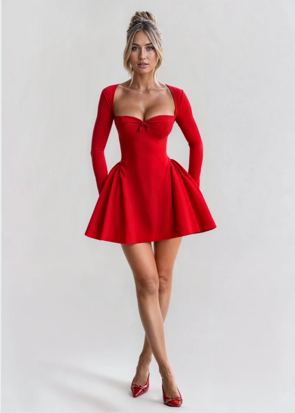 Red long-sleeve mini dress with bow detail, a snug fit. Elegant and stylish design, suitable for formal events or parties.