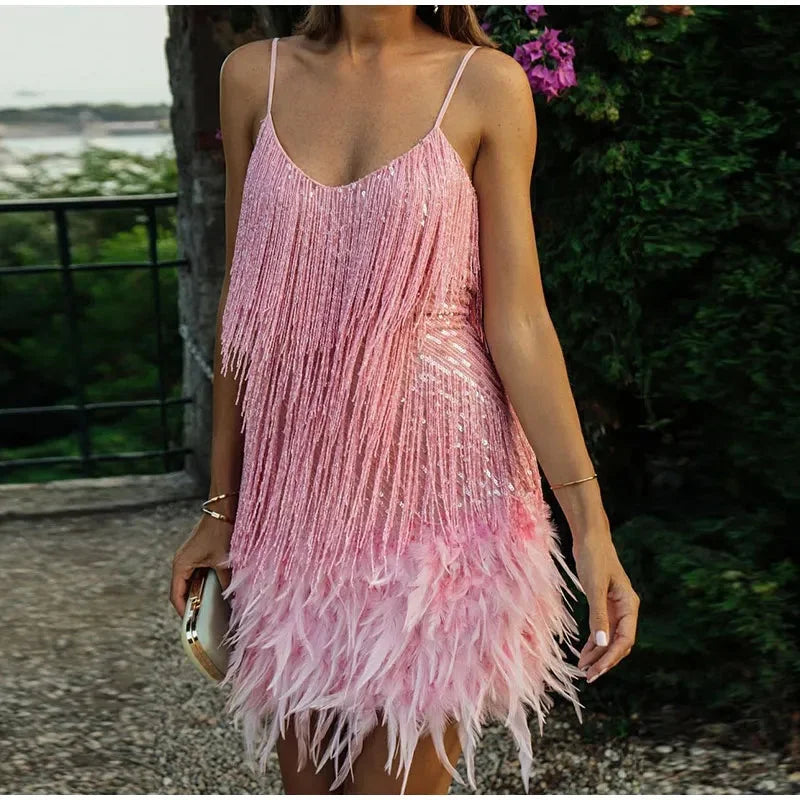 Pink Alinna mini dress with feathered sequin detailing. Flattering silhouette and perfect for a night out.