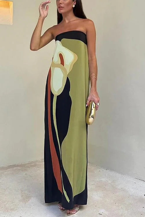 Strapless abstract print maxi dress in lightweight fabric with vibrant colors and flowy silhouette for a chic summer look.