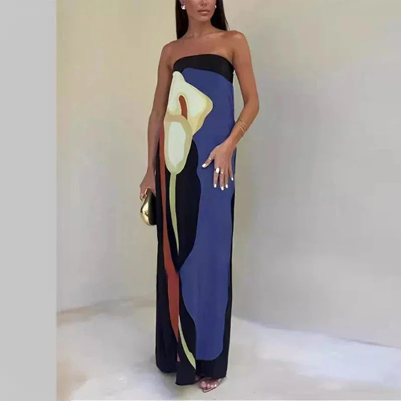 Blue strapless maxi dress with abstract print design, perfect for a casual yet stylish look. Made from lightweight and…