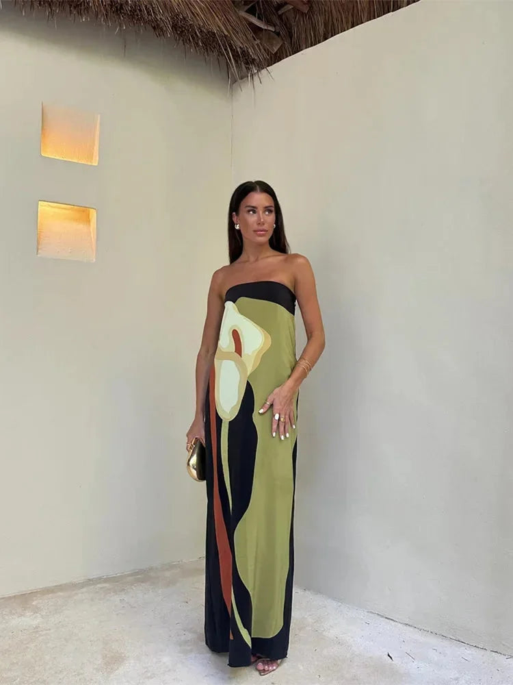 Green strapless maxi dress with abstract print design, perfect for an elegant evening. Made from lightweight and breathable…