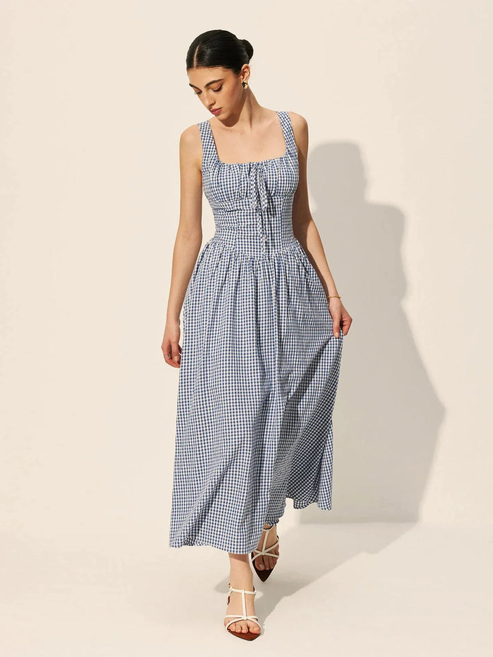 Sleeveless navy gingham midi dress in cotton fabric, perfect for a casual chic look.