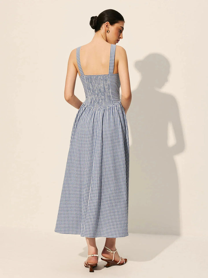 "Sleeveless navy gingham midi dress made of cotton fabric, perfect for any casual occasion."