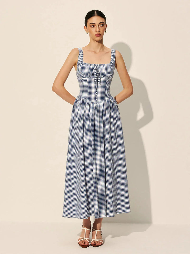 "Sleeveless navy gingham midi dress made of comfortable cotton fabric in a classic blue color"
