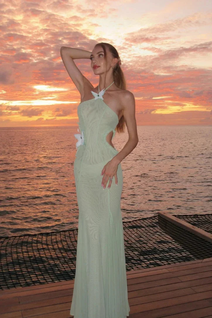 Mint halter mermaid fit dress for women with a flowy skirt, perfect for date nights or special occasions.