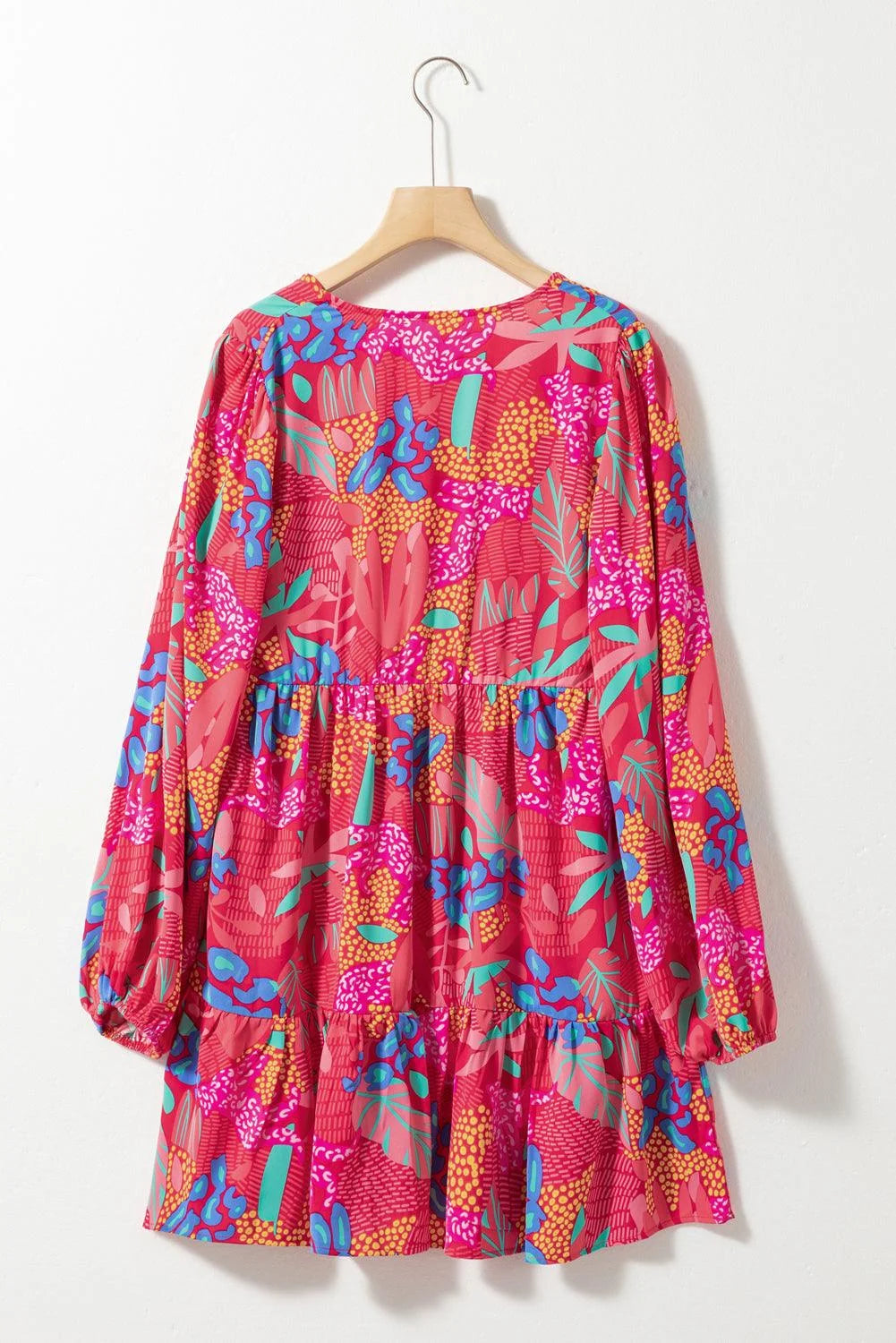 Floral print mini dress with ruffled sleeves in bright colors perfect for summer outings.