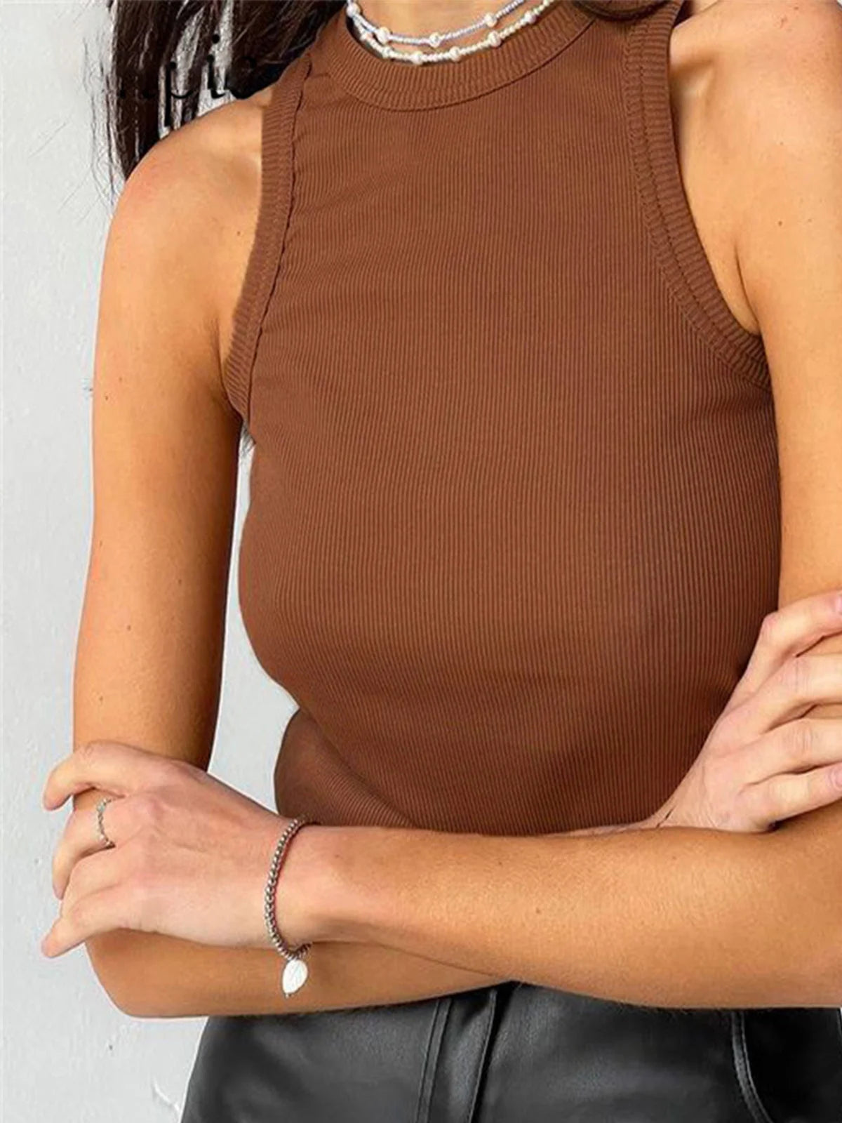 Light brown sleeveless top with a relaxed fit, perfect for casual wear. Made from soft and breathable fabric for all-day…