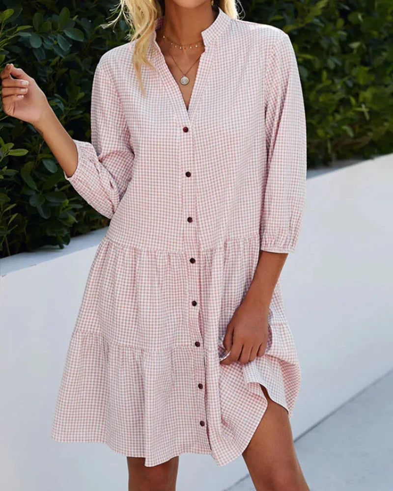 White button-up midi dress with relaxed fit, perfect for everyday wear. Made of soft, breathable fabric with stylish design.