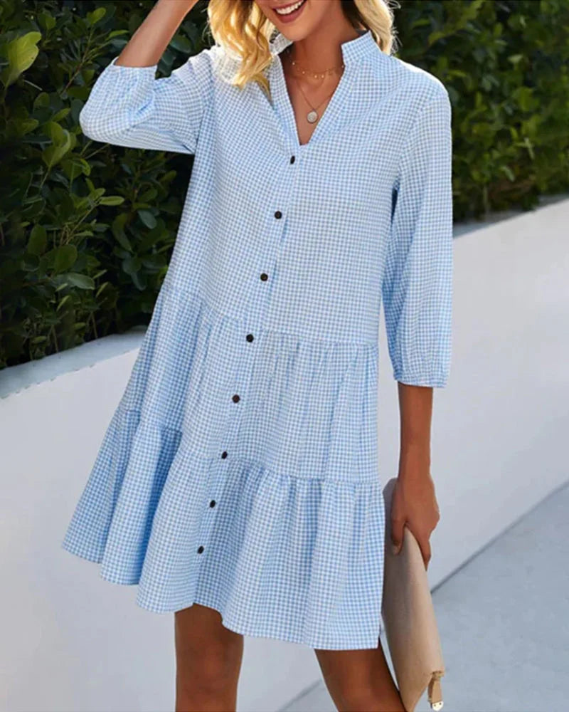 Blue Button-up Midi Dress in relaxed fit with Ambar style. Made of lightweight fabric with pockets and roll-up sleeves.