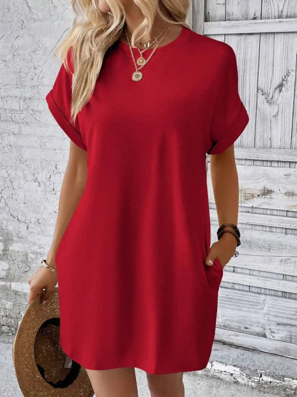 Red mini dress with side pockets, made from soft cotton blend. Relaxed fit and casual style ideal for everyday wear.