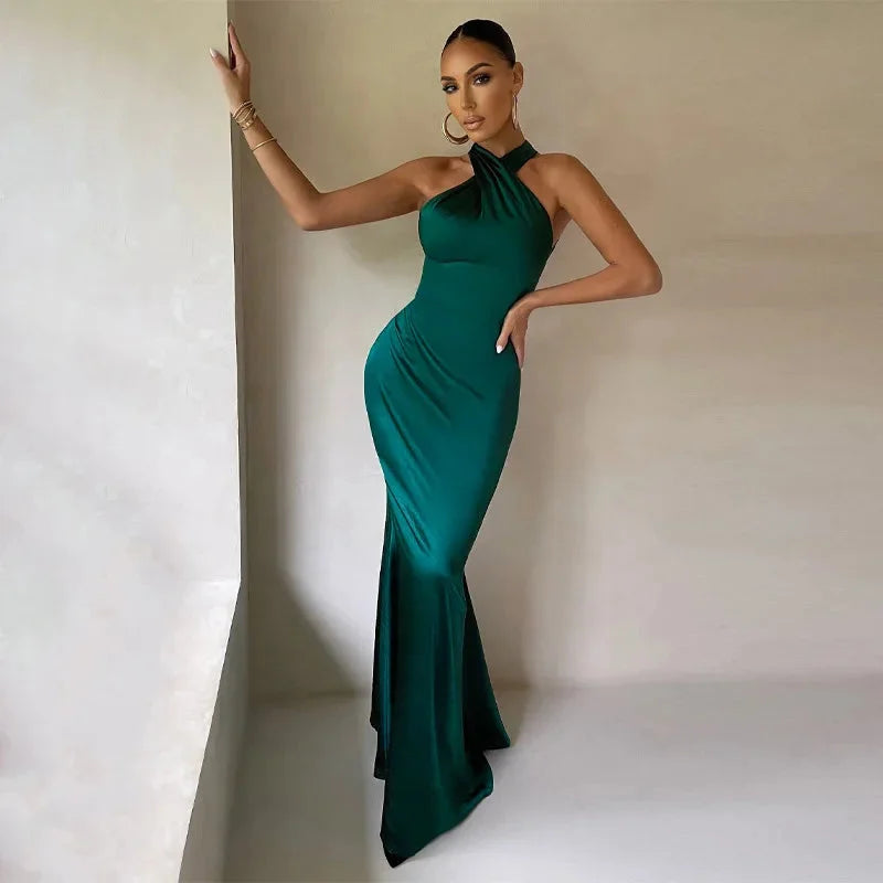 Green satin evening dress with a halter neck design, perfect for formal events or special occasions.