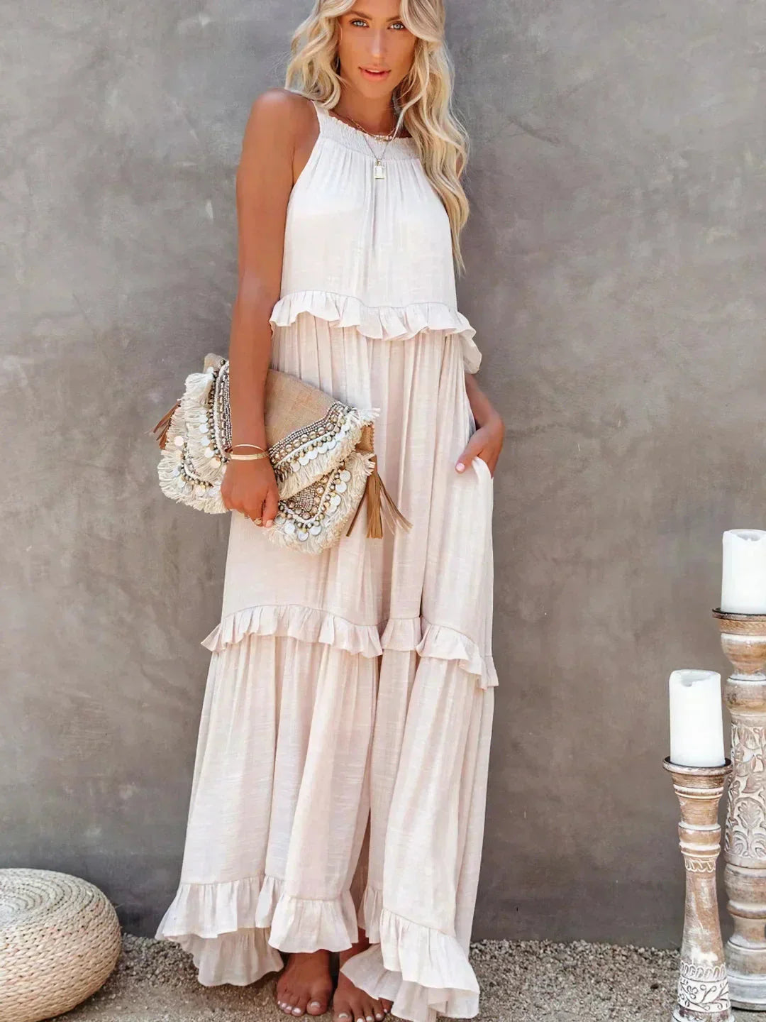 "Sleeveless maxi dress in tiered design with soft jersey fabric, perfect for casual and elegant summer looks."