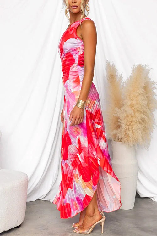 One-shoulder floral maxi dress featuring a vibrant floral pattern on lightweight, draped fabric with an elegant asymmetrical…