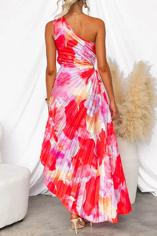 One-shoulder floral maxi dress with ruffled neckline and a flowy silhouette, perfect for a feminine and elegant look.