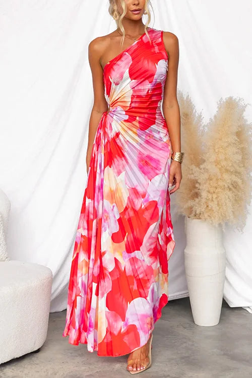 One-shoulder floral maxi dress with vibrant floral print on flowy fabric, featuring a stylish one-shoulder design.