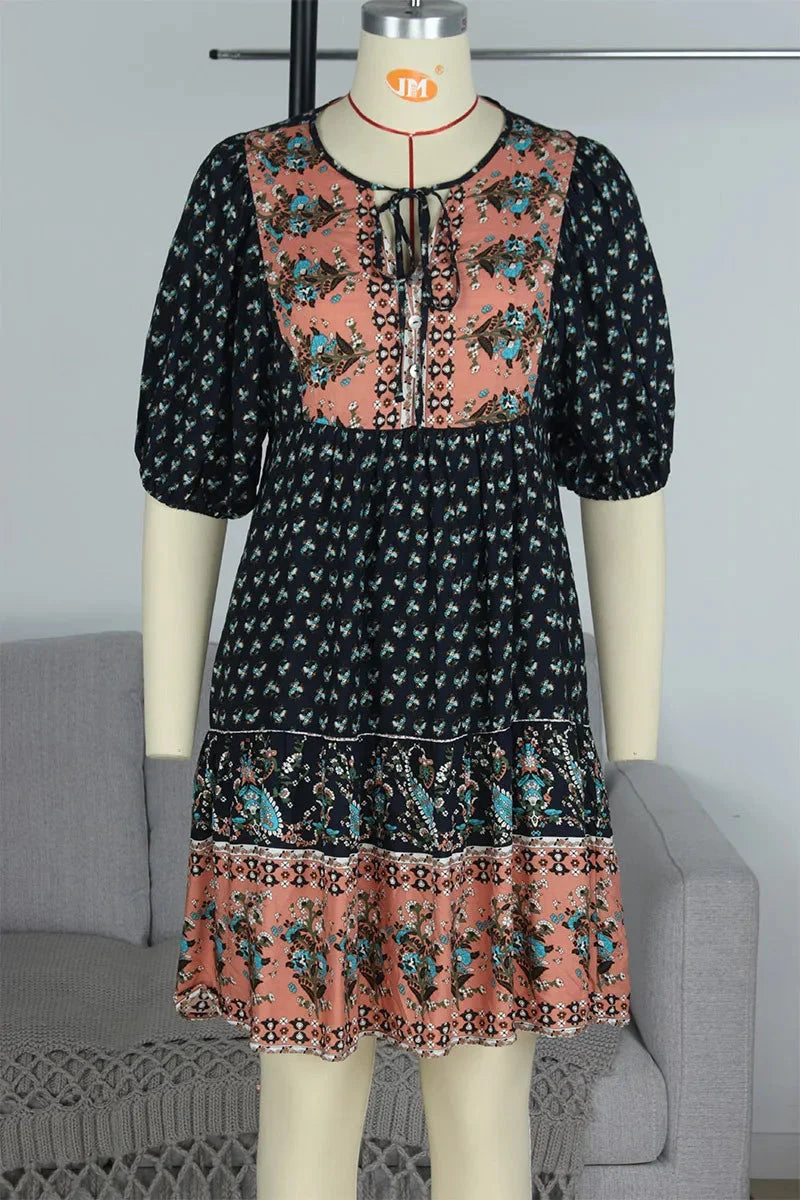 "Analayah patchwork midi dress featuring bohemian design with a mix of vintage fabrics in earth tones"