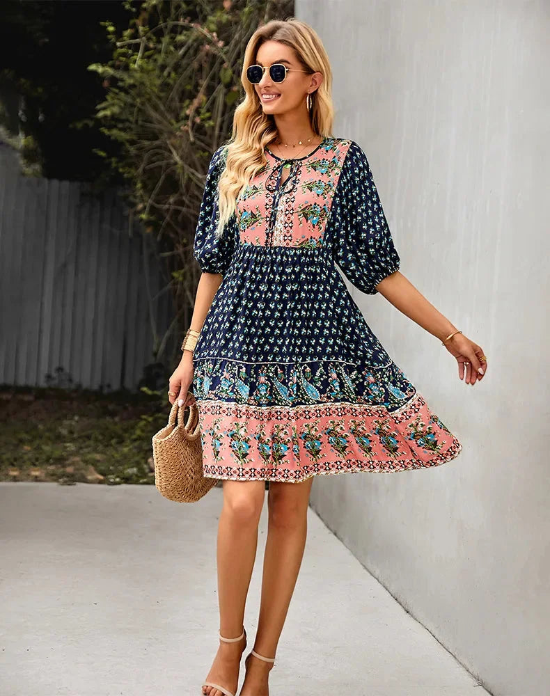 Bohemian patchwork midi dress in soft and flowy fabric with eclectic patterns and vibrant colors for a whimsical and…