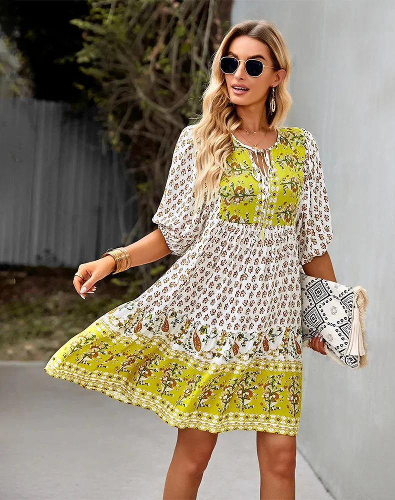 Bohemian patchwork midi dress with colorful patterns, perfect for a casual chic look at any event.