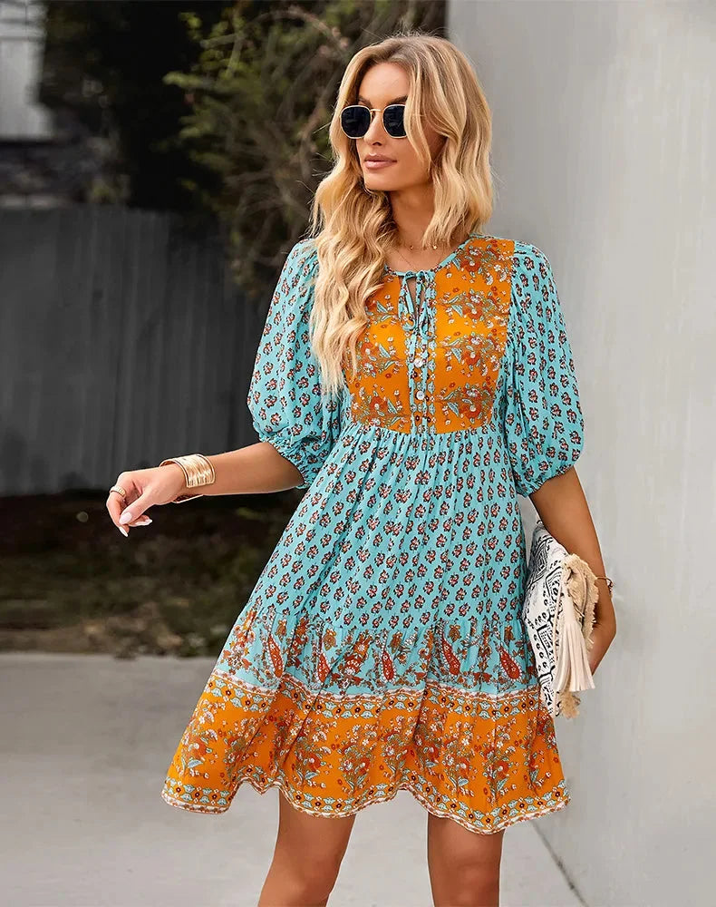 "Analayah Bohemian patchwork midi dress featuring colorful patchwork design with flowy silhouette, perfect for a boho chic…