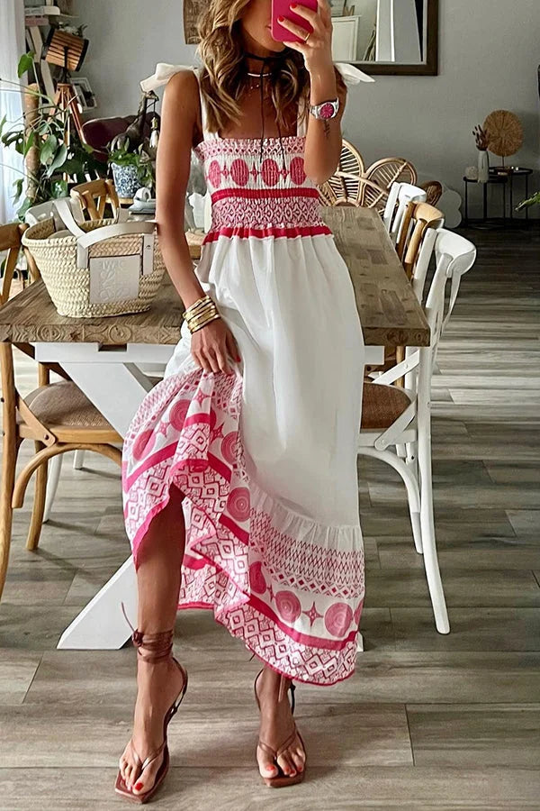 "White maxi dress with pink accents, featuring a flowy design and breathable fabric perfect for summer strolls."