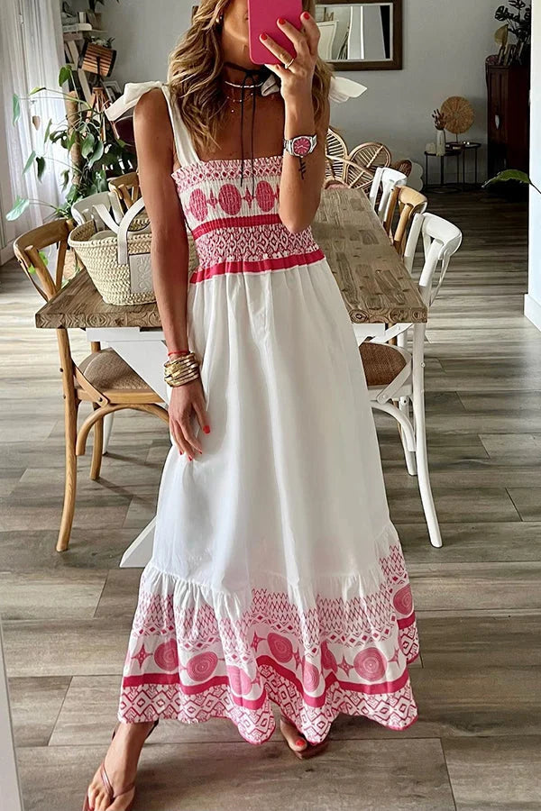 White maxi dress with pink accents, perfect for summer days. Featuring a flowy design and made from lightweight cotton…