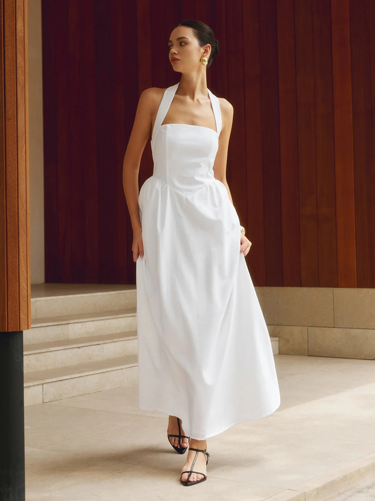 White halter neck A-line maxi dress by Aryiah with a flowy silhouette, perfect for warm weather.