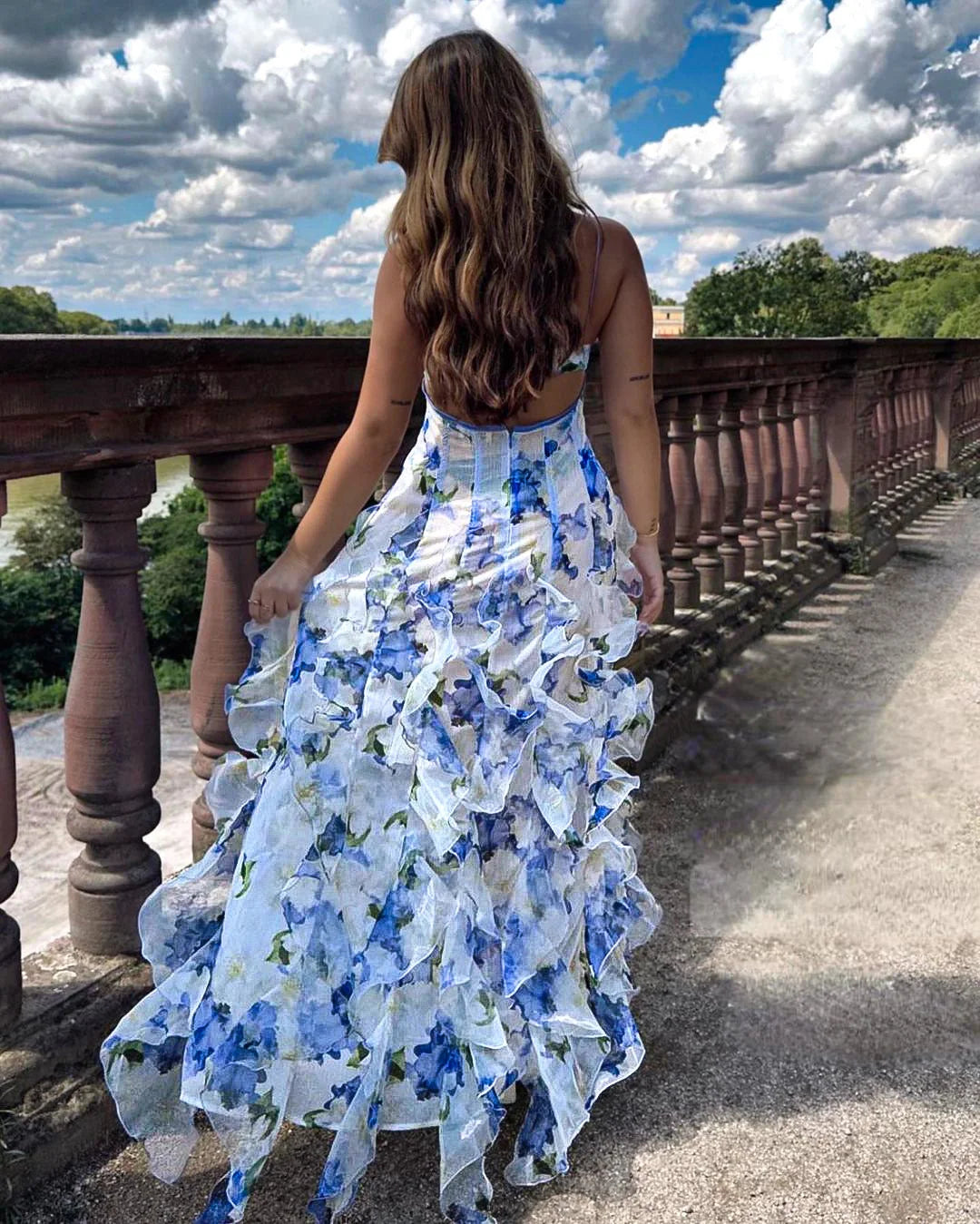 Blue floral dress with ruffles, featuring a delicate Aster print. Perfect for summer outings or casual events.