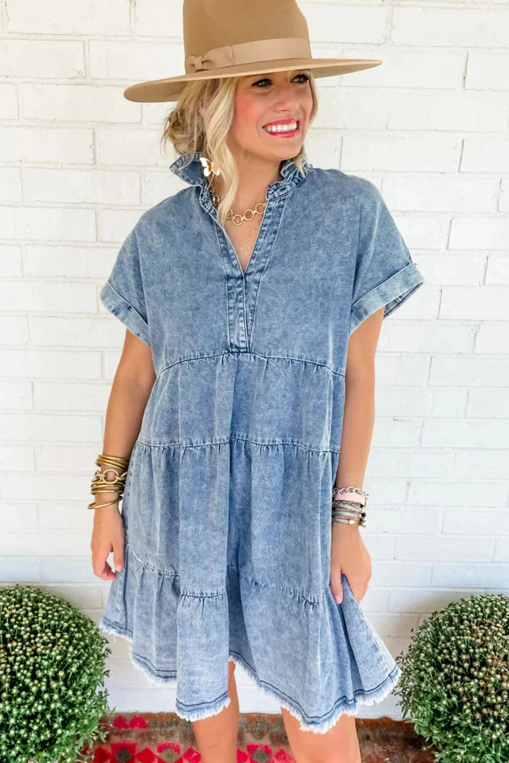 Denim dress with tiered design and ruffled hem by Avamarie, a stylish and modern choice for casual wear.