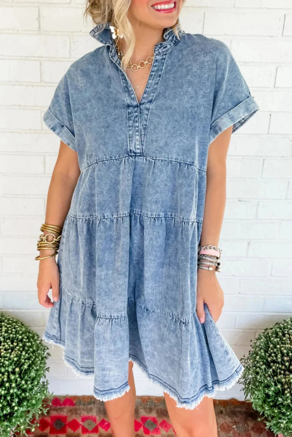 Sky blue tiered denim dress with ruffled hem by Avamarie, perfect for a chic and casual look.