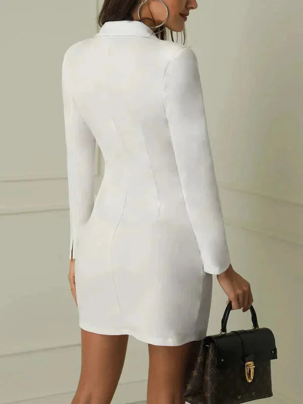 Navy blue blazer dress with waist-fitting silhouette, featuring elegant gold buttons. Timeless and versatile wardrobe staple.