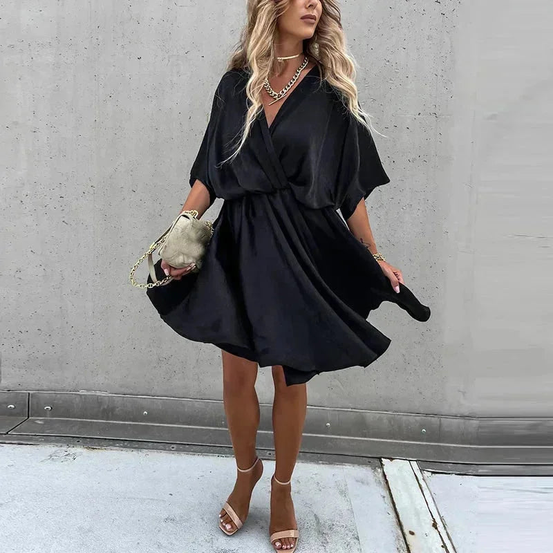 Women's summer flowy dress in vibrant colors, loose fit, and breathable fabric perfect for sunny days.