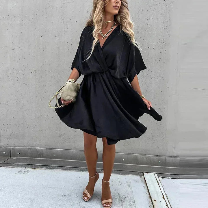 Women's summer flowy dress in vibrant colors, loose fit, and breathable fabric perfect for sunny days.
