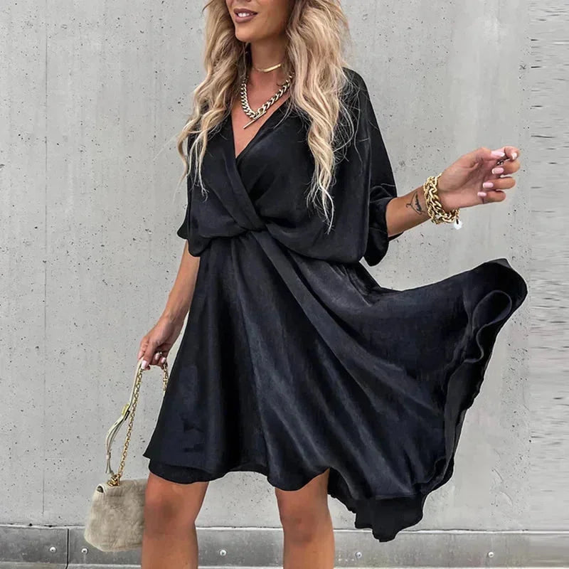 "Black sleeveless flowy dress for summer, made from lightweight breathable fabric with a relaxed fit."